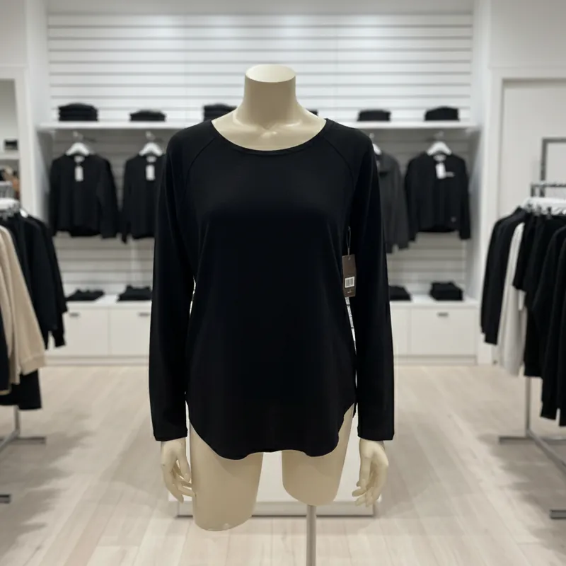 Nally & Millie Ladies' Black Crew Neck Long Sleeve Rounded Hem Top